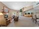 Spacious lounge area with fireplace, comfortable seating, and large windows for community enjoyment at 8757 E Dry Creek Rd # 1512, Englewood, CO 80112