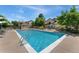 Sparkling pool surrounded by lounge chairs offers a refreshing outdoor amenity for residents at 8757 E Dry Creek Rd # 1512, Englewood, CO 80112