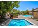 Community pool and hot tub with lounge chairs and seating areas, perfect for relaxation at 8757 E Dry Creek Rd # 1512, Englewood, CO 80112