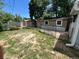 Wide backyard with small building and chain link fence at 1738 Dallas St, Aurora, CO 80010