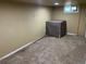 Unfinished basement area with carpeting and small window at 1738 Dallas St, Aurora, CO 80010