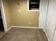 Unfinished basement with painted walls and carpeted floor at 1738 Dallas St, Aurora, CO 80010