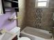 Bathroom featuring a bathtub, toilet, and vanity with sink at 1738 Dallas St, Aurora, CO 80010