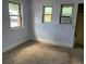 Carpeted bedroom featuring an AC unit in the window with natural light at 1738 Dallas St, Aurora, CO 80010