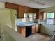 Functional kitchen with wooden cabinets, black appliances, and tile floor at 1738 Dallas St, Aurora, CO 80010