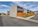 Exterior view of townhomes featuring balconies and wood fences at 7165 S Gaylord St # E07, Centennial, CO 80122