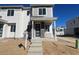 Charming two-story home with stone accents around the front door and a well-manicured lawn at 22833 E Tufts Ave # B, Aurora, CO 80015