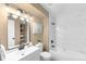 Chic bathroom featuring a vanity with modern fixtures and a bathtub with stylish tile at 921 S Walden Street # 205, Aurora, CO 80017