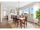 Bright dining room features a rustic table and chandelier at 3093 Belay Pt, Castle Rock, CO 80108