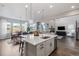 Open kitchen with large island and breakfast bar seating at 3093 Belay Pt, Castle Rock, CO 80108