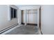 Bedroom showcasing closet with folding doors and a window at 660 S Alton Way # 12C, Denver, CO 80247