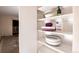 Organized closet with shelving and cleaning supplies at 660 S Alton Way # 12C, Denver, CO 80247