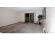 Empty living room with sliding glass doors to balcony at 660 S Alton Way # 12C, Denver, CO 80247
