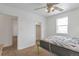 Bright bedroom with a ceiling fan, neutral walls, and carpeted floors, ready for personalization at 6900 E 66Th Ave, Commerce City, CO 80022