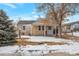 Charming home featuring a cozy front porch and mature trees at 6900 E 66Th Ave, Commerce City, CO 80022