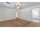 Inviting living room showcasing neutral walls, ceiling fan, and doorway to an adjoining room at 6900 E 66Th Ave, Commerce City, CO 80022
