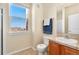 Bright bathroom featuring a shower and a large window offering scenic views at 4100 Albion St # 307, Denver, CO 80216