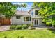 Well-maintained backyard with lush lawn and mature trees at 9916 Spring Hill Ln, Highlands Ranch, CO 80129