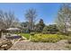 Large backyard featuring a gazebo, lush landscaping, and mature trees at 9916 Spring Hill Ln, Highlands Ranch, CO 80129