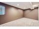 Finished basement room with a window and neutral colored carpet at 9916 Spring Hill Ln, Highlands Ranch, CO 80129