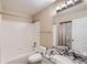 Bathroom features a granite vanity, tub and shower combination, and good lighting at 9916 Spring Hill Ln, Highlands Ranch, CO 80129