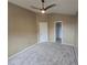 Bedroom with neutral-colored walls, plush carpet, and closet featuring a ceiling fan at 9916 Spring Hill Ln, Highlands Ranch, CO 80129