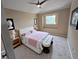 Bright bedroom featuring a ceiling fan, neutral walls, and decorative touches at 9916 Spring Hill Ln, Highlands Ranch, CO 80129