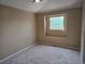 Cozy bedroom with a neutral color palette and a large window at 9916 Spring Hill Ln, Highlands Ranch, CO 80129