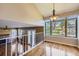 Bright dining area with large windows, hardwood floors, and a view of the outdoor landscape at 9916 Spring Hill Ln, Highlands Ranch, CO 80129