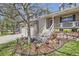 Beautifully landscaped front yard with decorative lighting and elegant stone and mulch landscaping elements at 9916 Spring Hill Ln, Highlands Ranch, CO 80129