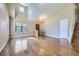 Spacious living room featuring high ceilings, hardwood floors, and large windows for natural light at 9916 Spring Hill Ln, Highlands Ranch, CO 80129