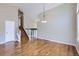 Open living room featuring hardwood floors, high ceilings, and a staircase at 9916 Spring Hill Ln, Highlands Ranch, CO 80129