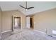 Spacious main bedroom with a vaulted ceiling, ceiling fan, and ensuite bathroom at 9916 Spring Hill Ln, Highlands Ranch, CO 80129