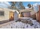 View of backyard, showing a brick structure and wooden fence at 1155 Garfield St, Denver, CO 80206