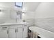 Modern bathroom with white cabinets, quartz countertop, and a clawfoot tub at 1155 Garfield St, Denver, CO 80206