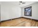 Bright bedroom featuring hardwood floors and a ceiling fan at 1155 Garfield St, Denver, CO 80206