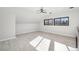 Large bedroom with light gray walls and laminate wood floors at 1155 Garfield St, Denver, CO 80206