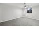 Spacious basement bedroom with grey carpet and ceiling fan at 1155 Garfield St, Denver, CO 80206