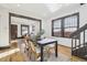 Bright dining room with hardwood floors and a view into the living room at 1155 Garfield St, Denver, CO 80206