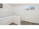 Upper level hallway with white walls and wood-look flooring at 1155 Garfield St, Denver, CO 80206