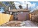 Rear view of house showing back door and detached garage at 1155 Garfield St, Denver, CO 80206