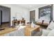 Living room with hardwood floors, neutral colors, and ample natural light at 1155 Garfield St, Denver, CO 80206