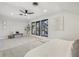 Main bedroom with wood-look floors, a barn door, and large windows at 1155 Garfield St, Denver, CO 80206