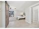 Main bedroom with wood-look floors, a barn door, and large windows at 1155 Garfield St, Denver, CO 80206