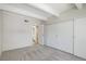 Bedroom with closet, neutral carpet and a view of the ensuite bathroom at 2525 S Dayton Way # 1109, Denver, CO 80231