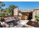 Private deck featuring an outdoor seating area, a dining table, and a built-in jacuzzi tub at 2525 S Dayton Way # 1109, Denver, CO 80231