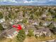 This aerial view highlights a charming townhome nestled in a lush, tree-filled community, boasting a peaceful and inviting atmosphere at 12406 E Pacific Cir # D, Aurora, CO 80014