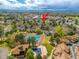 Community aerial view showcases landscaping, tennis courts, and swimming pool at 12406 E Pacific Cir # D, Aurora, CO 80014
