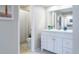 Bright bathroom featuring a shower/bathtub, vanity, and a toilet at 12406 E Pacific Cir # D, Aurora, CO 80014