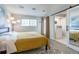 Bedroom with a large window and closet visible with an ensuite bathroom at 12406 E Pacific Cir # D, Aurora, CO 80014